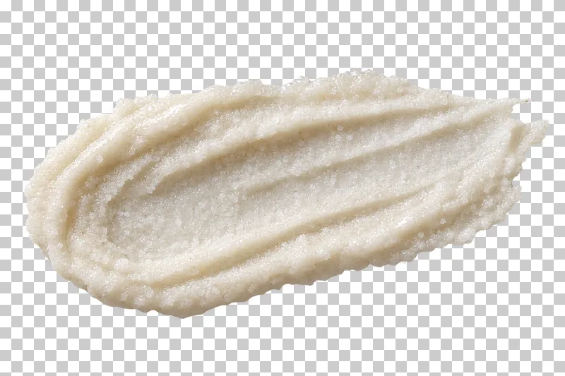 Finer pale salt grains in a moist creamy binder.