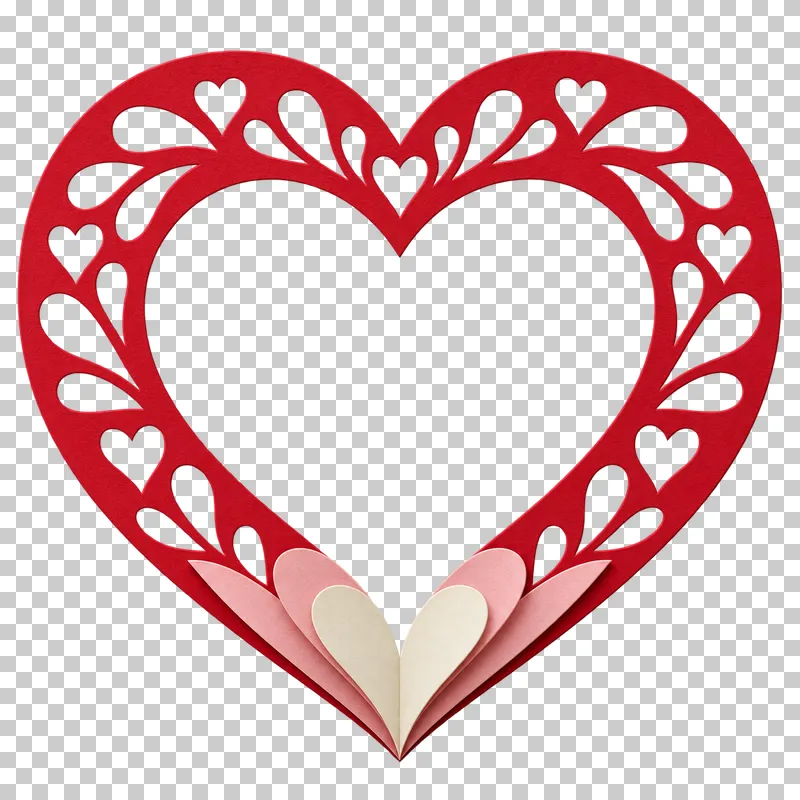 A paper heart with lace-like cutout details.