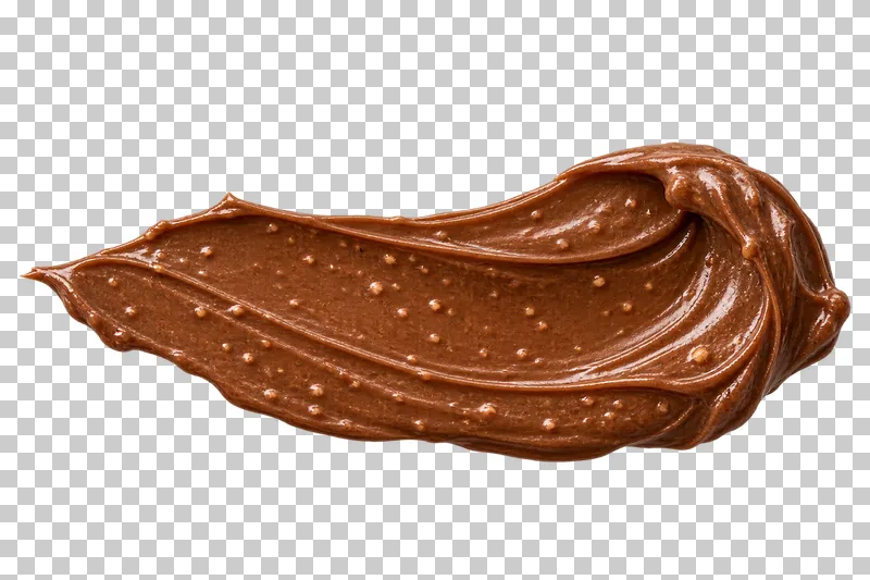 A chocolate-hazelnut spread smear with fine nut particles and a curled knife ridge.