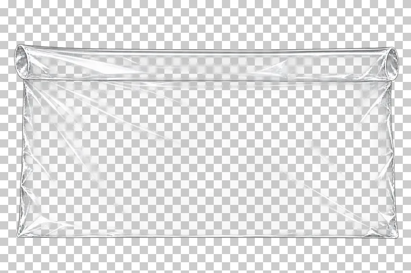 A clear film sheet with one long edge curled back into a shallow continuous roll.