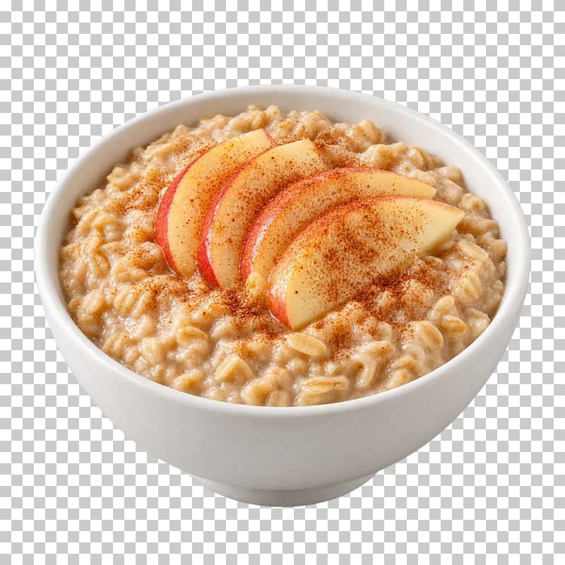 A white bowl of cooked oatmeal with apple slices and cinnamon.