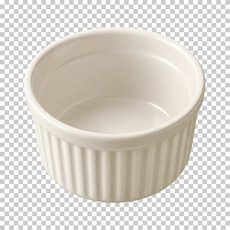 An empty ivory ceramic ramekin with a round opening and vertically fluted sides.