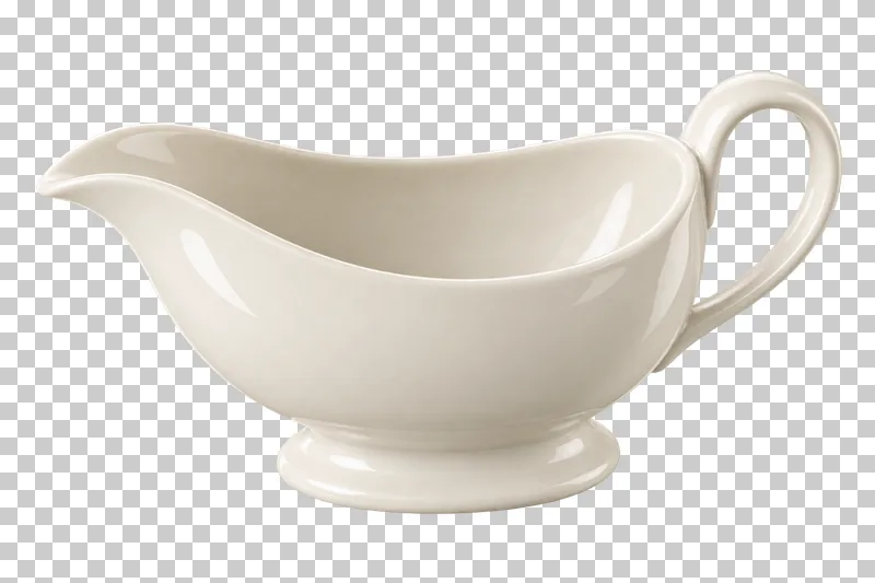 An empty ivory gravy boat with a pouring spout, curved handle and oval foot.