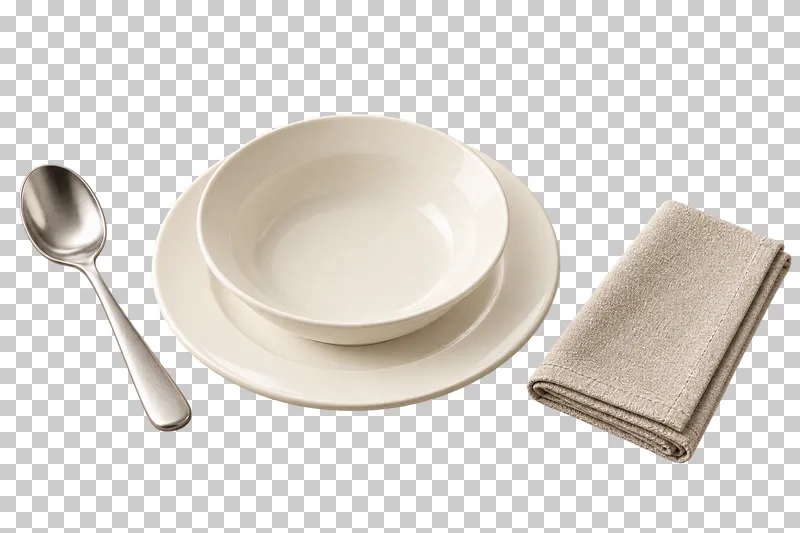 A soup-course setting with an empty ivory bowl on a plate, a steel spoon and a folded linen napkin.