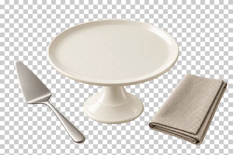 An empty ivory pedestal cake stand arranged with a steel cake server and folded linen napkin.