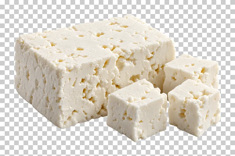 A porous white feta block beside three serving cubes.