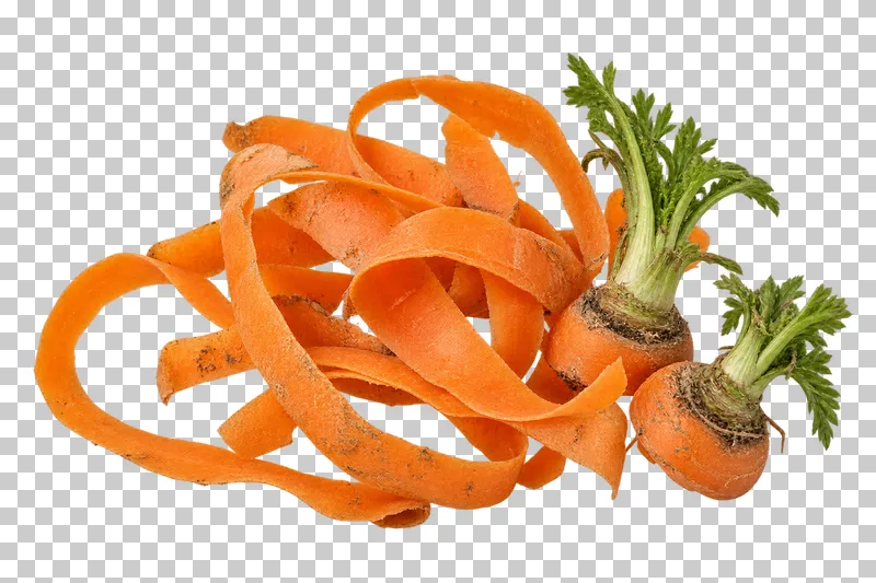 Small group of carrot peelings and trimmed tops.