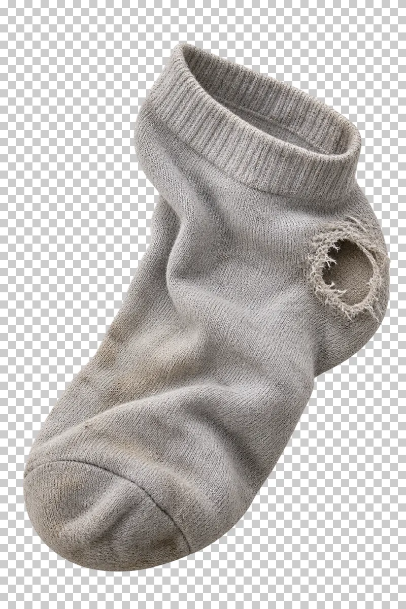Worn cotton sock with a heel hole.