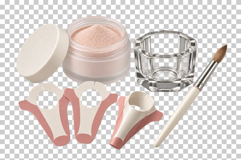 An acrylic-extension arrangement with powder, a glass dish, a sculpting brush, and three paper forms.