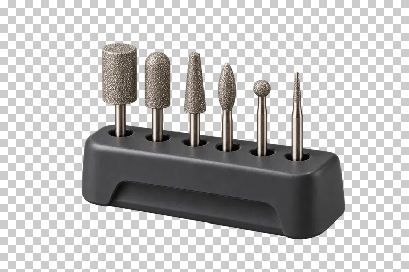 Six different nail-drill bits seated in a graphite holder.