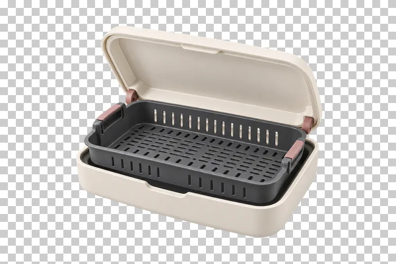 An open ivory instrument-disinfection tray with a graphite slotted basket.