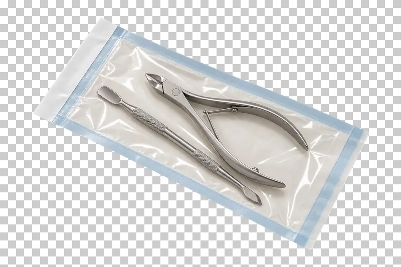 A sealed paper-and-film instrument pouch containing a steel cuticle pusher and cuticle nippers.