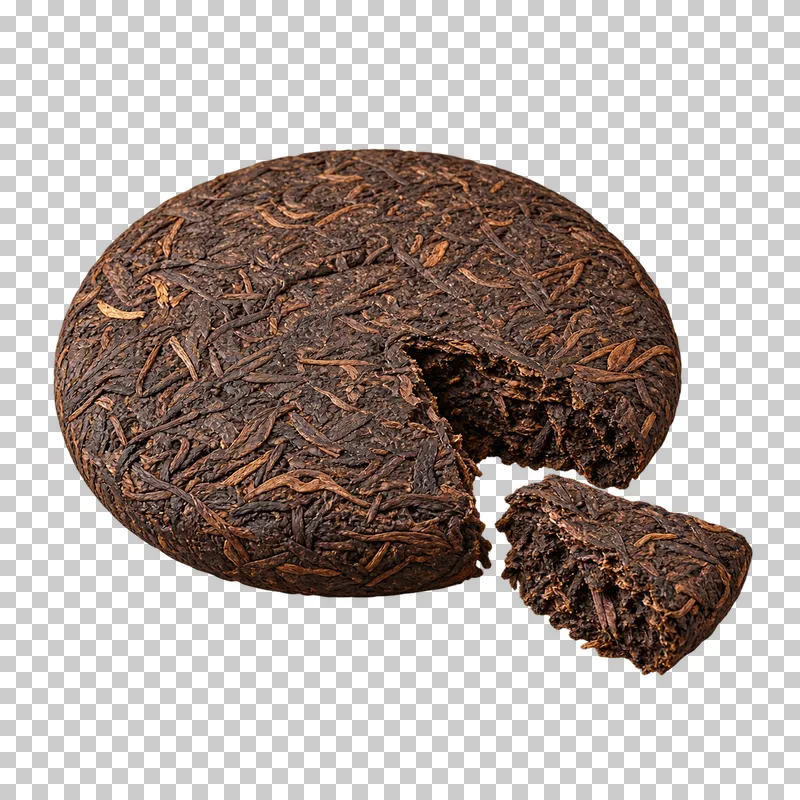 A compressed dark pu-erh tea cake with a broken wedge placed beside it.