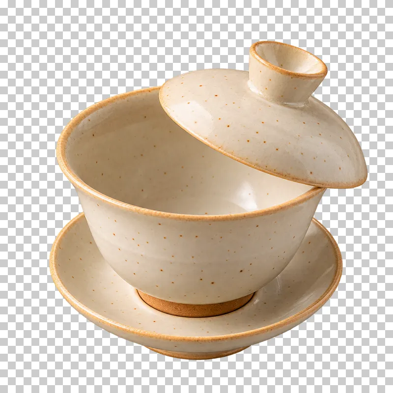 An ivory gaiwan on a saucer with its lid tilted above the empty bowl.