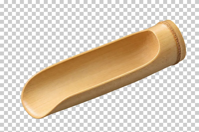 A broad trough-shaped bamboo scoop for loose tea leaves.