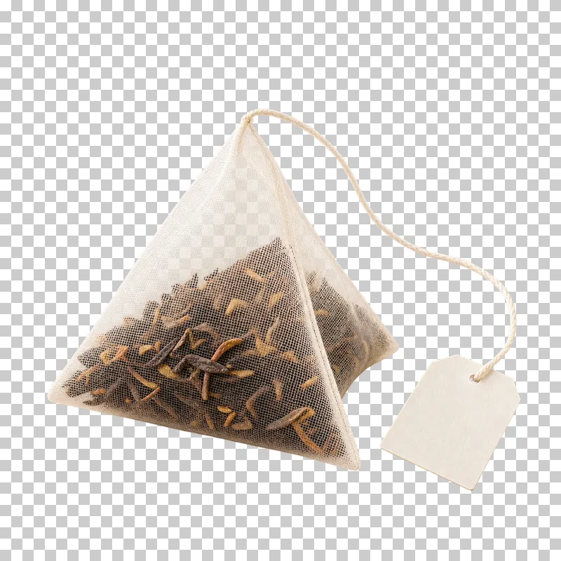 A translucent pyramid tea sachet containing loose leaves, with a string and blank tag.