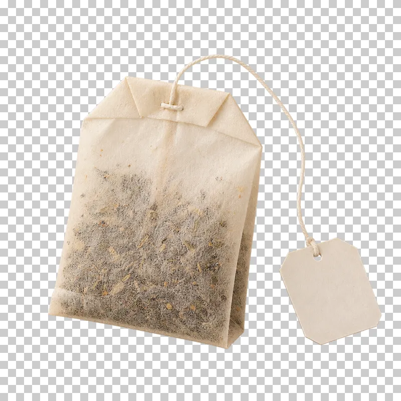An unused pale paper tea bag with a string and blank paper tag.