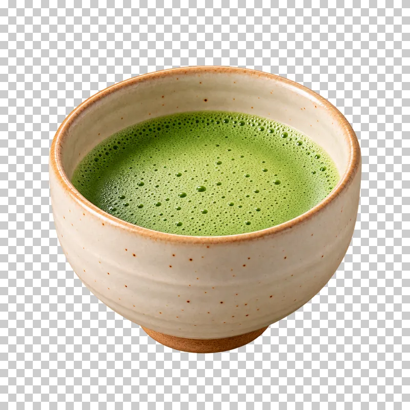 Freshly whisked green matcha with fine foam in an ivory ceramic chawan.