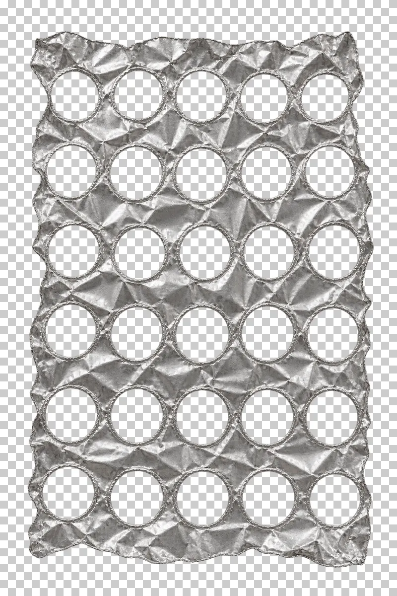 A tall silver foil panel with 30 round openings in five columns and six rows.
