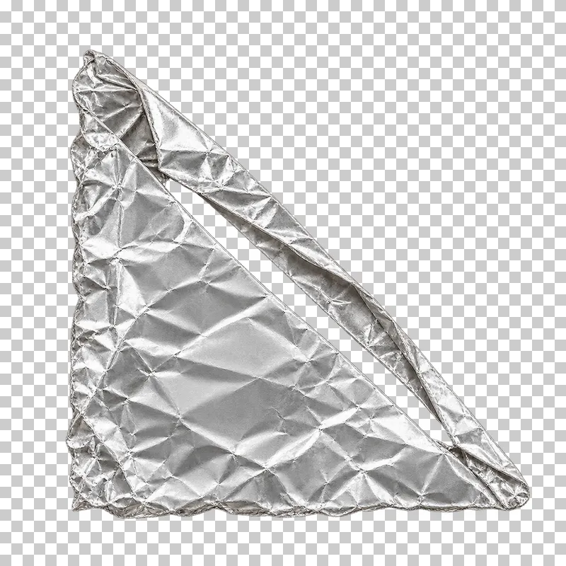 A triangular folded silver foil photo corner pocket with an open diagonal slot.