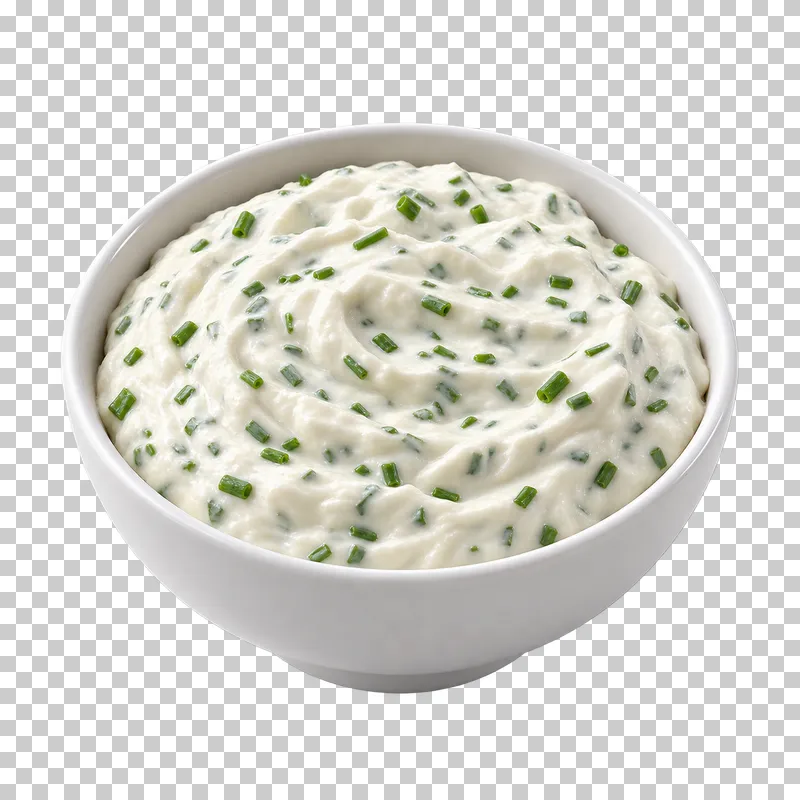 A plain white ceramic bowl filled with sour cream and chive dip.