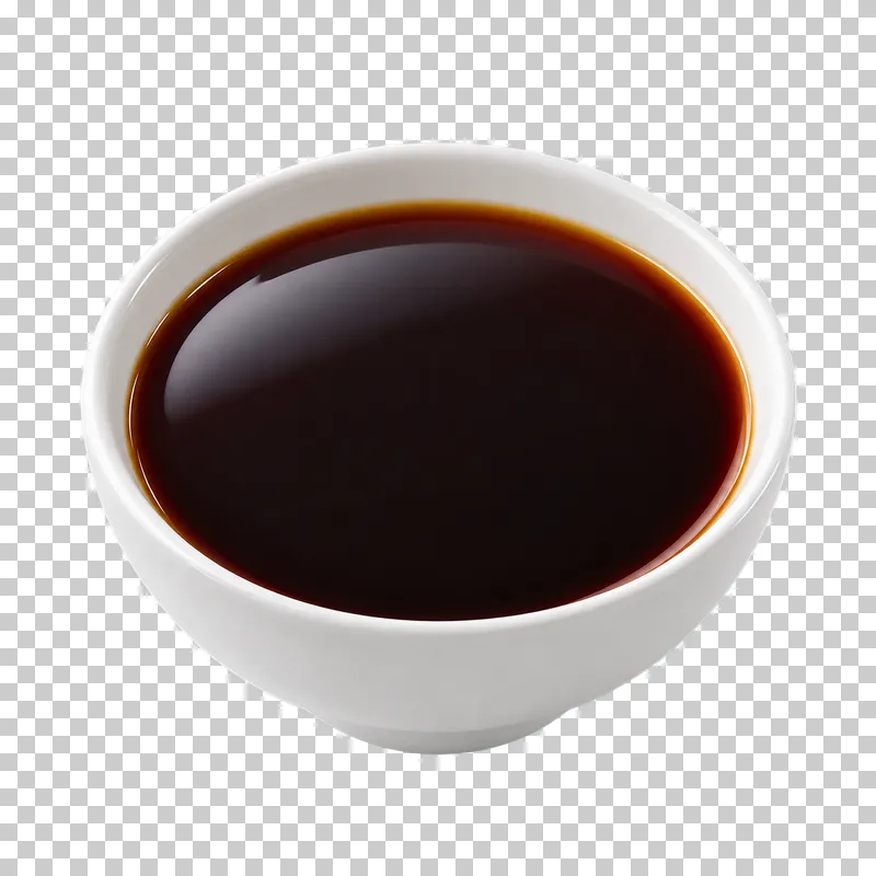 A plain white ceramic bowl filled with soy sauce.