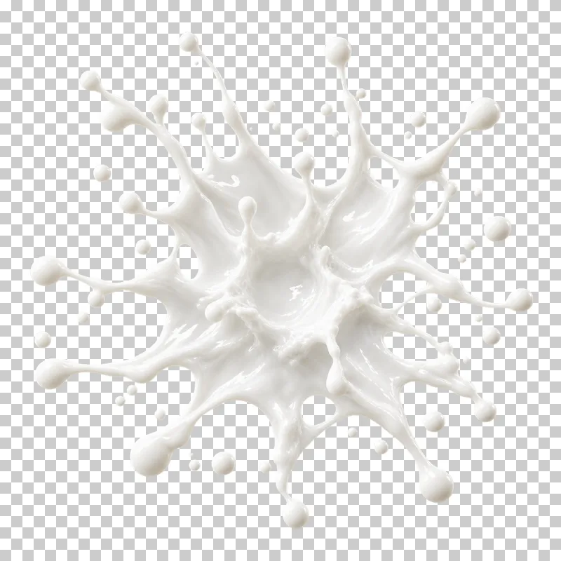 An overhead radial milk splash with irregular tongues around its center.
