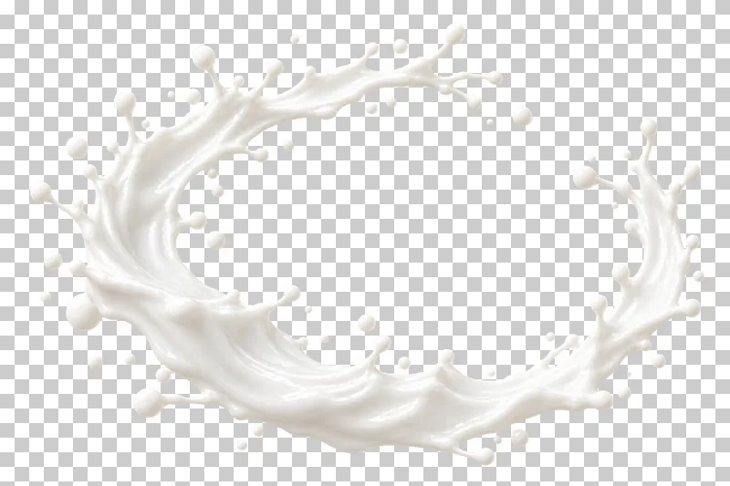 An open oval milk ring with a clear center and scattered droplets.