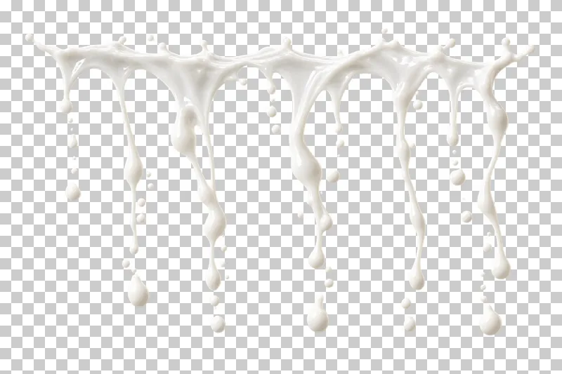 A wide milk curtain with long descending strands and falling droplets.