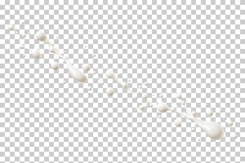 A sparse diagonal trail of small and stretched milk droplets.