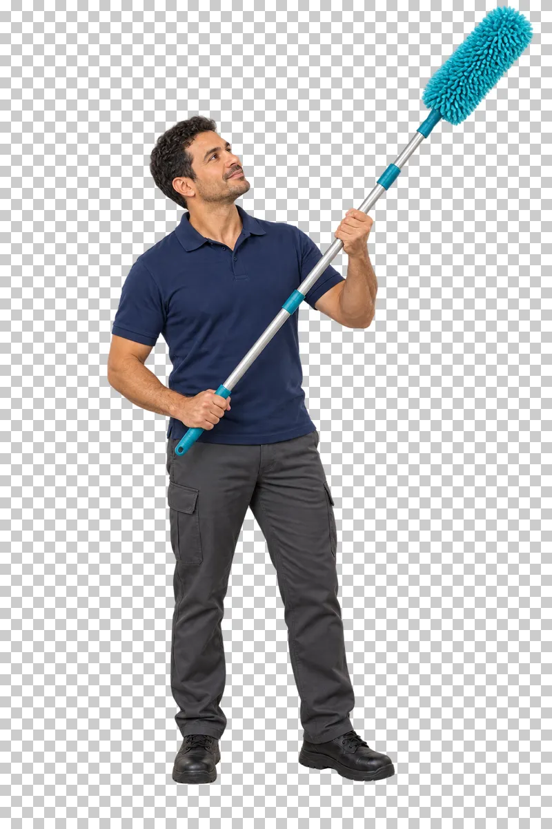 A male cleaner looking upward while holding a telescopic microfiber duster.