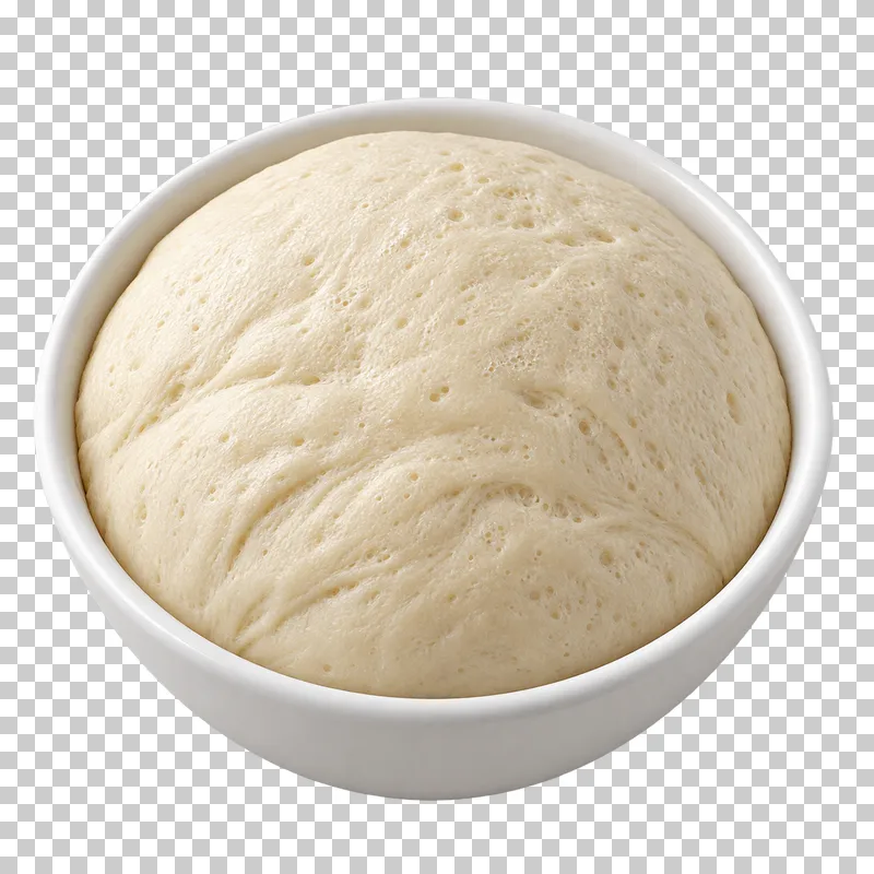 Expanded aerated bread dough doming inside a white mixing bowl.