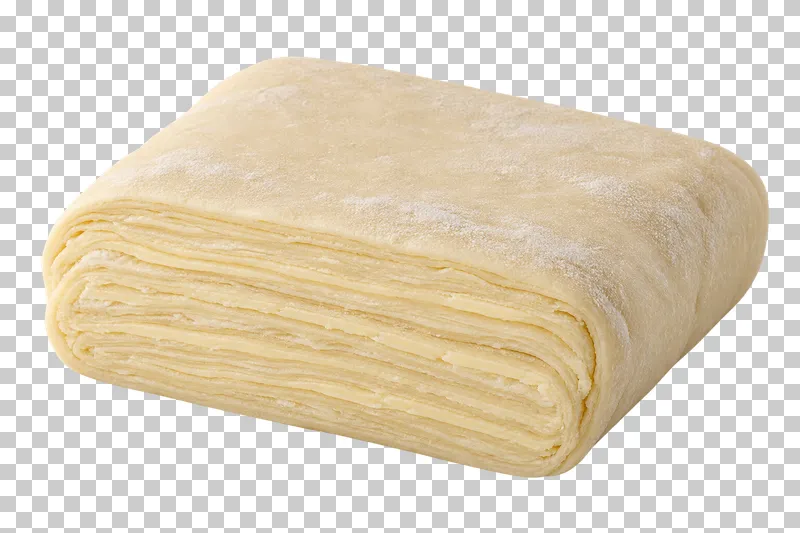 A raw laminated dough block with thin layers visible at the cut face.