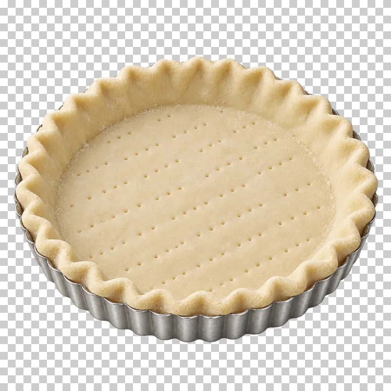 A pale unbaked pie shell with a docked base in a silver fluted tin.