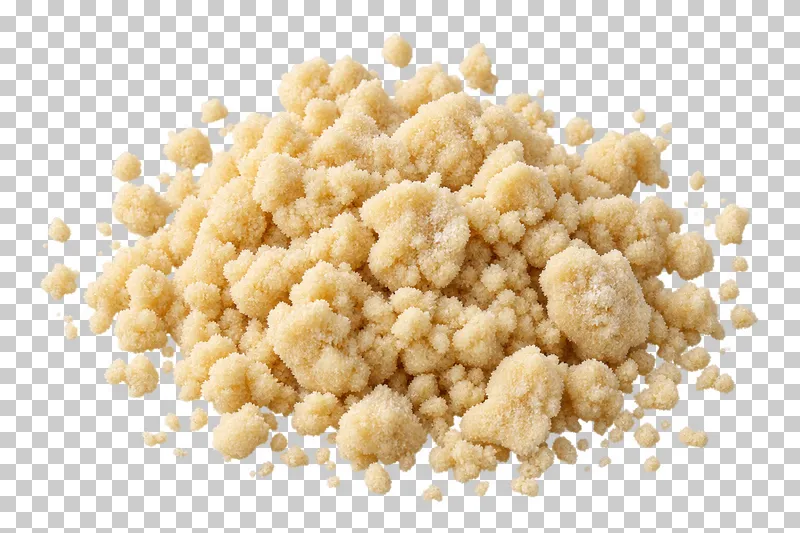 Coarse pale raw streusel crumbs with detached smaller pieces.