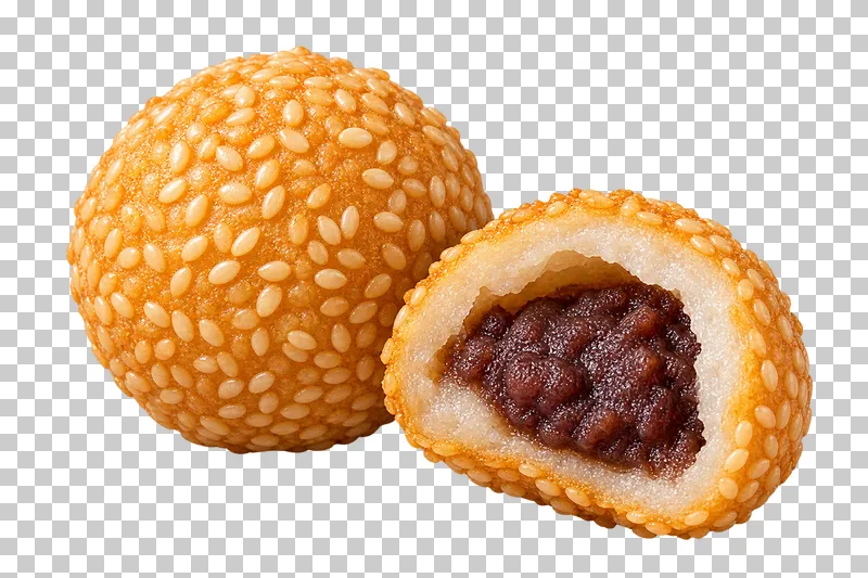 A whole sesame ball and a half exposing chewy rice shell, hollow space and dark red-bean paste.