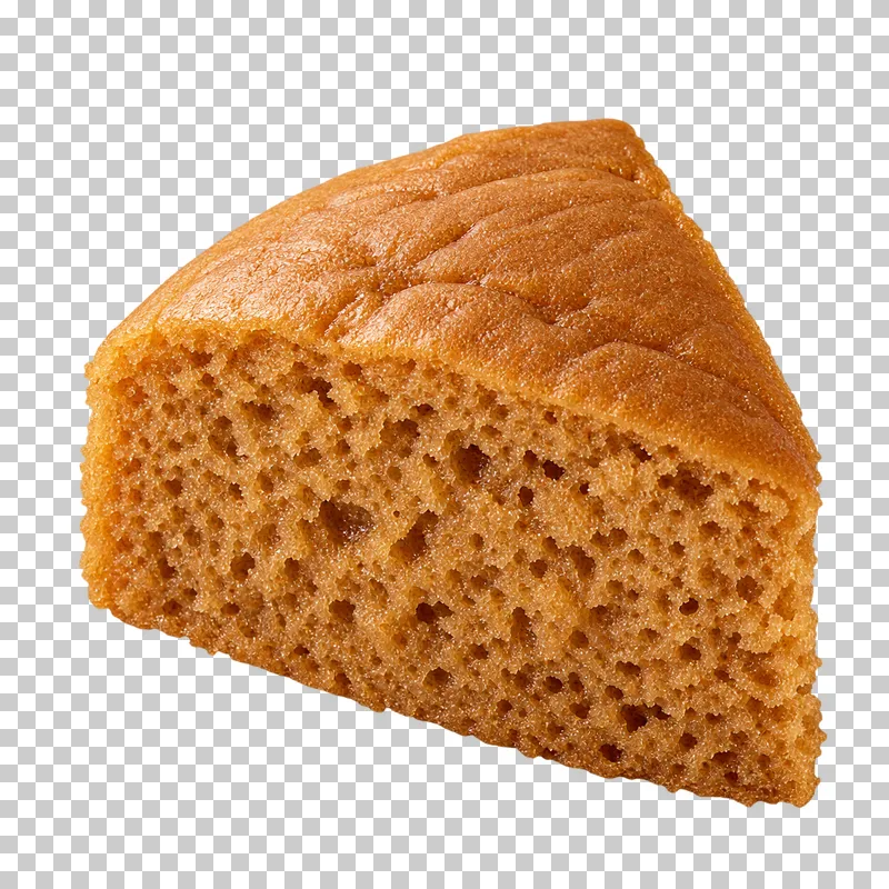 A tall brown-sugar steamed sponge wedge with open crumb and a soft unglazed top.