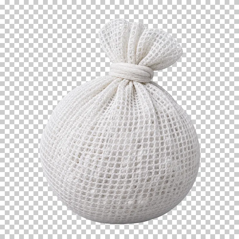 A white chalk-filled mesh ball with a gathered and tied fabric neck.