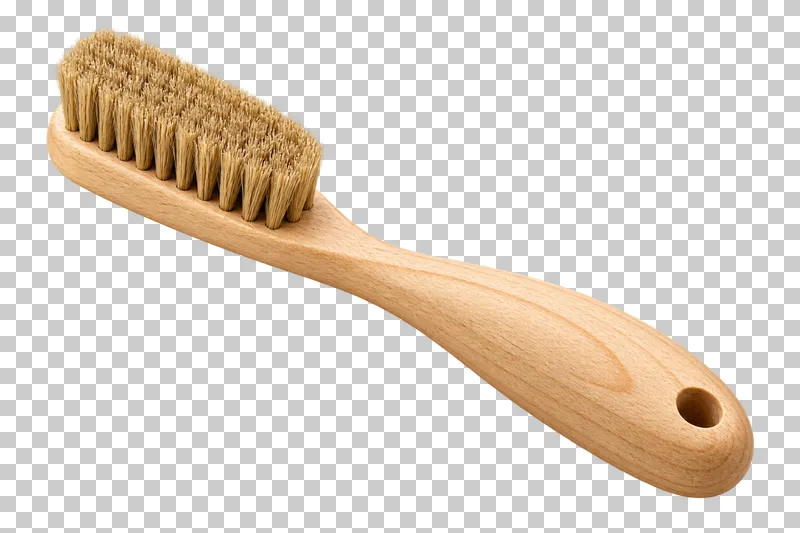 A pale wooden climbing hold brush with a curved handle and a dense natural-bristle head.