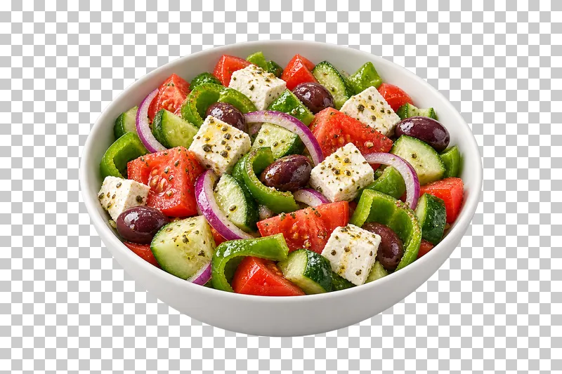 A white bowl of Greek village salad with tomato, cucumber, green pepper, onion, olives and feta.
