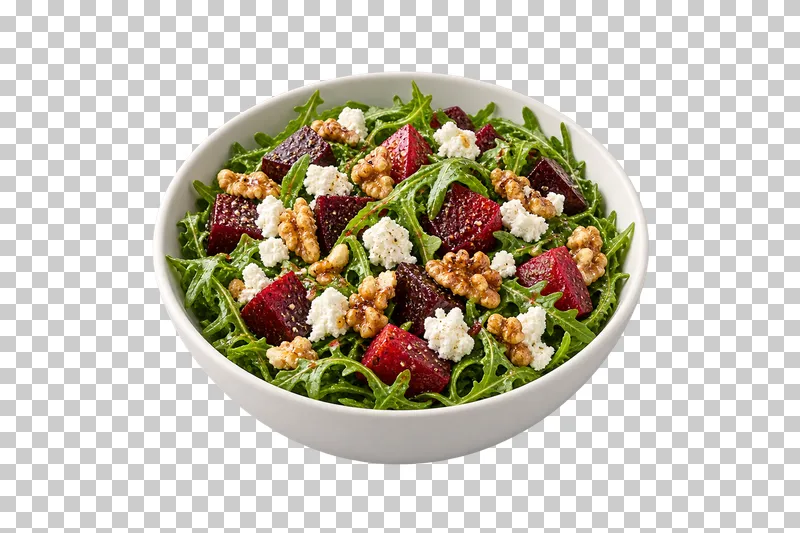 A white bowl of roasted beet, goat cheese and walnut salad over arugula.