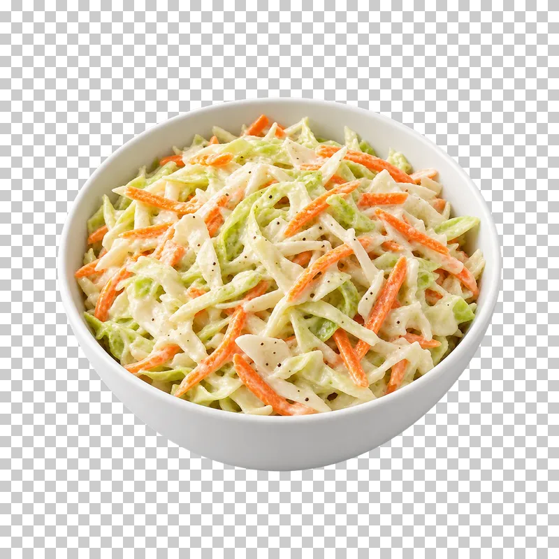 A white bowl of creamy coleslaw made from thin cabbage and carrot ribbons.