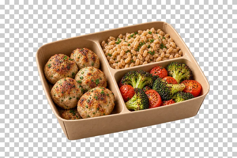 An open unbranded kraft box with compartments of turkey meatballs, farro, roasted broccoli and tomatoes.