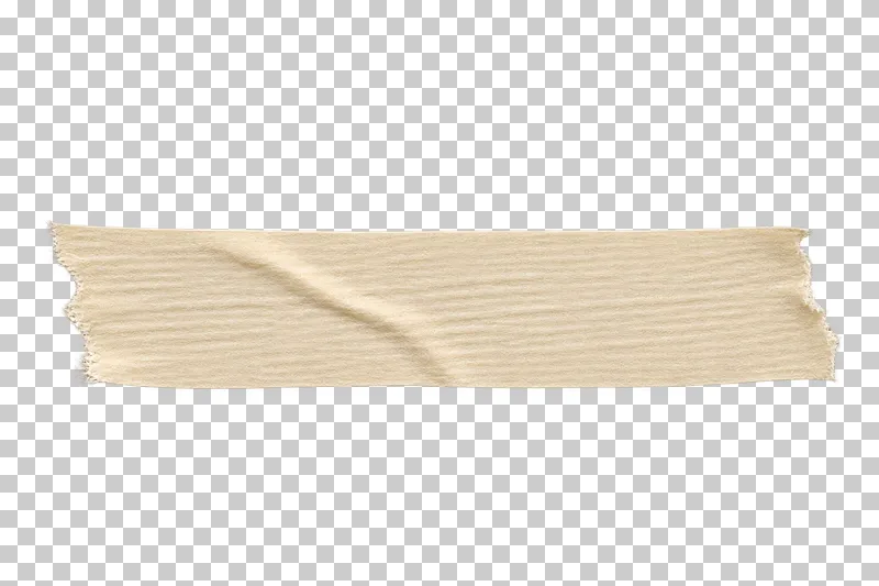 A warm cream crepe masking tape strip with hand-torn ends and a shallow diagonal crease.