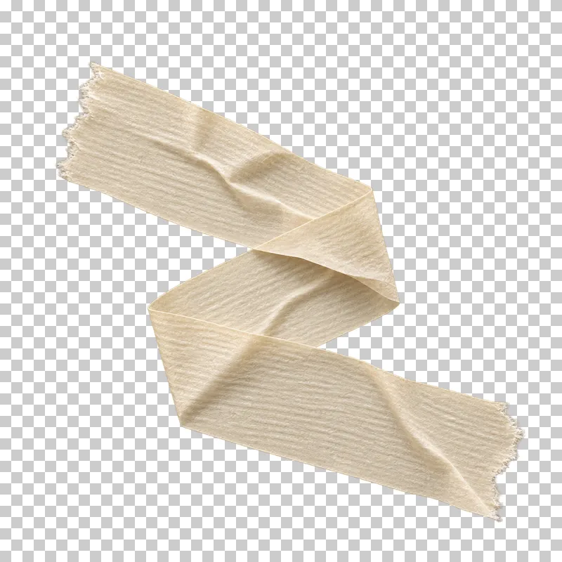 A continuous cream masking-tape ribbon folded into an irregular compact zigzag.