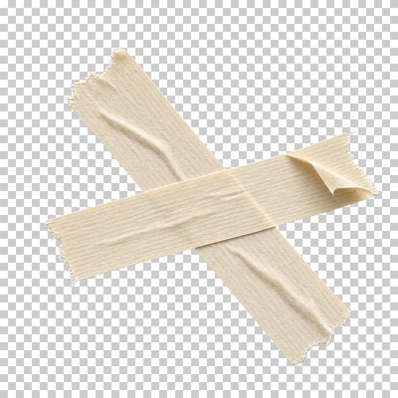 Two unequal cream masking tape strips crossing with a visible front-to-back overlap.