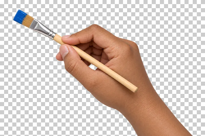 A medium-brown hand holds a flat paintbrush with blue paint on the bristles.