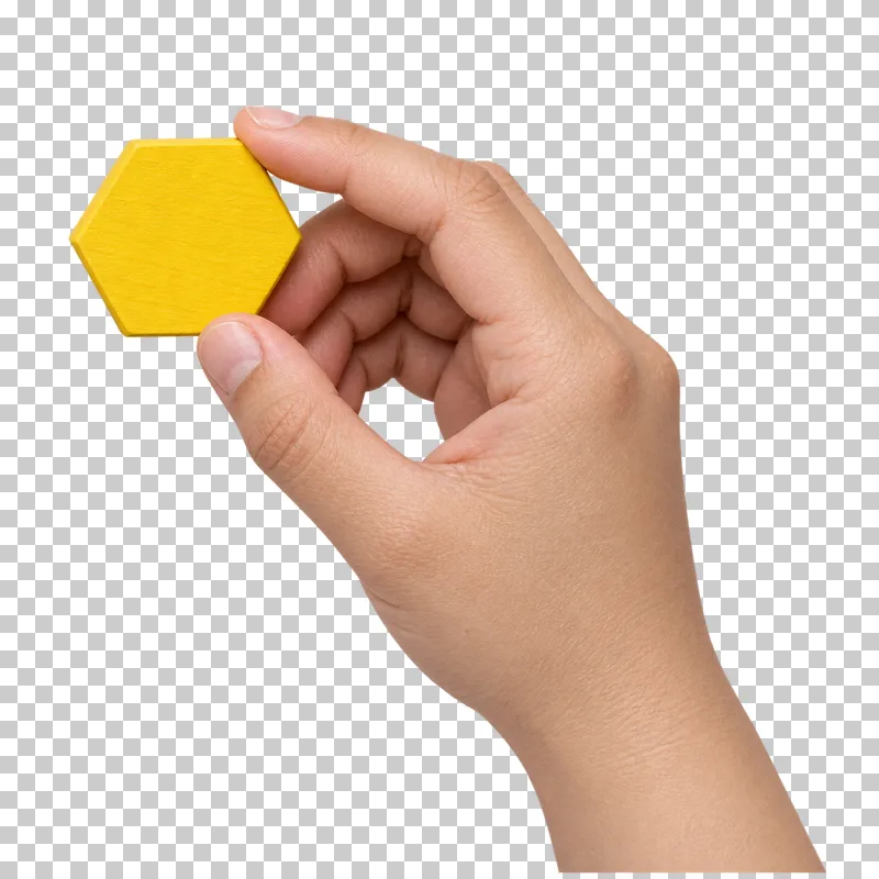 A light hand positions a shallow yellow hexagonal pattern block.