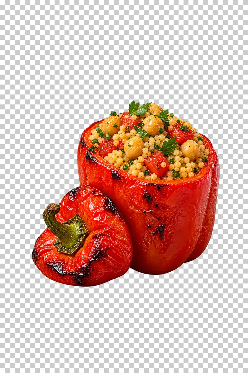 An upright cooked red pepper filled with couscous, chickpeas, tomato and herbs, with its stemmed lid beside it.
