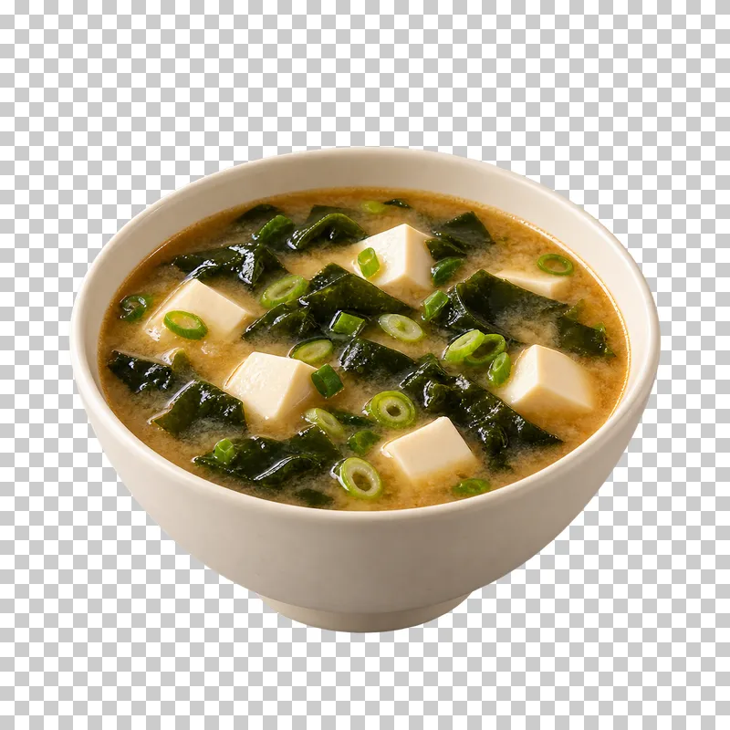 A deep ivory bowl of miso soup with tofu cubes, wakame and scallion.